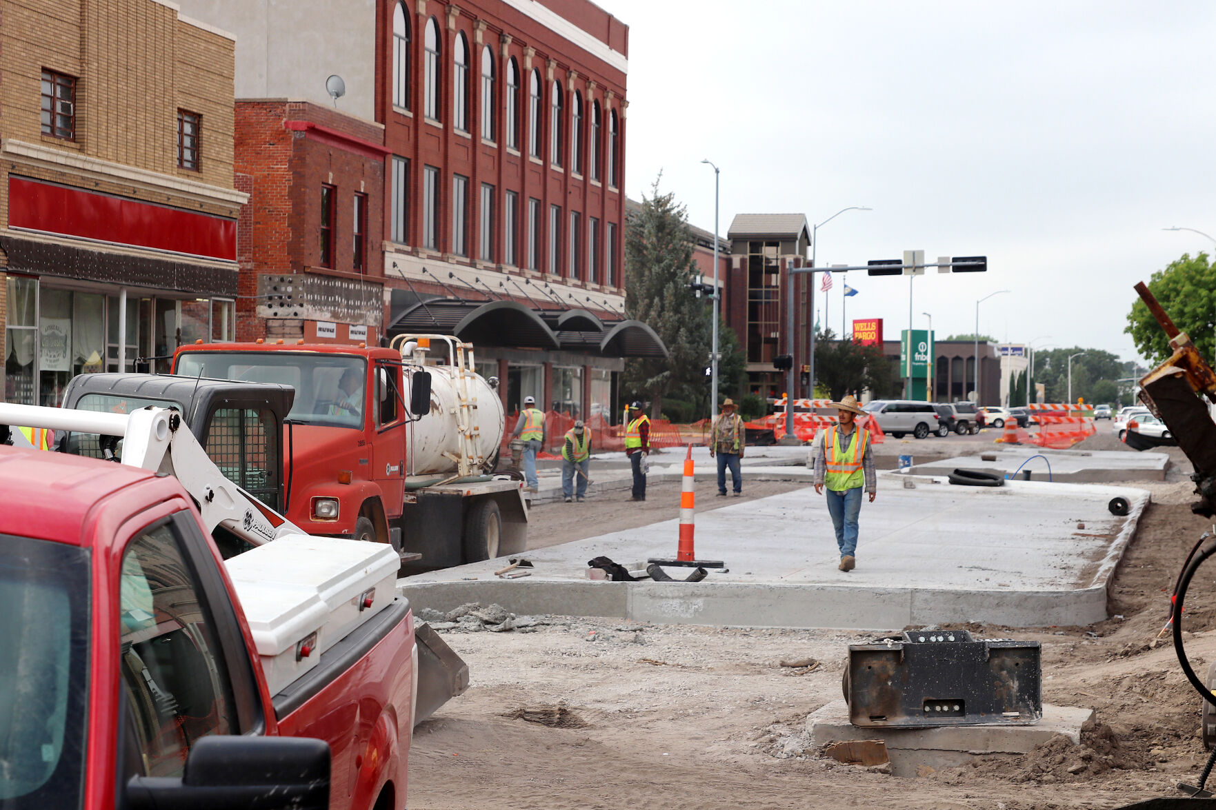 Closer to completion: Construction crews finishing concrete work along Dewey